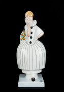 French Art Deco porcelain statue of "Columbine" by L'Hermine Pere & Fils, Guerine & Cie, Orchies, circa 1930, signed "DAX" on the front right corner of the base, 33cm high