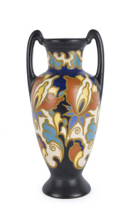 GOUDA Dutch pottery amphora shaped vase with black ground, circa 1932, signed "Regina, 341, Irene, W.B. Gouda, Holland", 34.5cm high