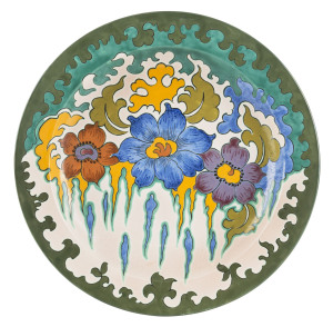 GOUDA Dutch pottery charger decorated with three flowers, circa 1920s, signed "2465/35, Cairo, Gouda, Holland", 35cm diameter