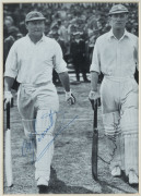 AUSTRALIA v ENGLAND: First Test Match at Nottingham, June 1938 C.J. Barnett (126) and Len Hutton (100) signed photograph depicting the two batsmen walking out to start their great opening stand. The match ended in a draw. Framed and glazed, overall 44 x 3 - 2