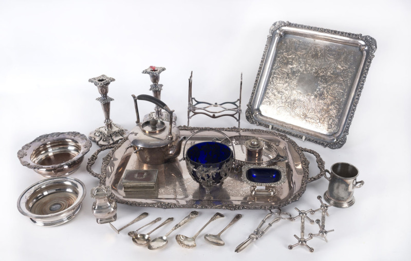 Silver plated trays, spirit kettle, candlesticks, wine coasters, utensils, dishes etc., 19th and 20th century, (20 items), the spirit kettle 27cm high