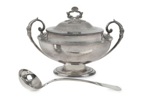 An English silver plated soup tureen with Neoclassical Greek key motif and dolphin handle, together with a soup ladle, 19th century, (2 items). 28cm high, 40cm across the handles