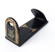 A Victorian bookstand, black Japanned finish with hand-painted floral motif, 19th century, ​17cm high