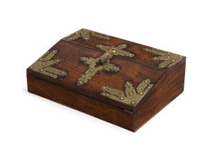 A fine English writing box, oak with brass mounts, interior sumptuously fitted in coromandel and purple velvet with gilded ink pots, circa 1860, 11.5cm high, 35.5cm wide, 25.5cm deep