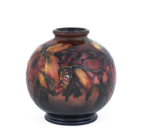 MOORCROFT flambe "Orchid" pattern pottery spherical vase, circa 1930s, original paper label "W. Moorcroft, By Appointment Potters To H.M. The Queen", 10.5cm high