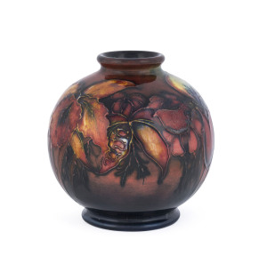 MOORCROFT flambe "Orchid" pattern pottery spherical vase, circa 1930s, original paper label "W. Moorcroft, By Appointment Potters To H.M. The Queen", 10.5cm high