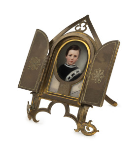 Miniature portrait of a boy in ornate gilt metal frame engraved "In Memory A.I.F.", 19th century, 14cm high