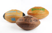 FOOTBALLS: "Adidas" football with 19 signatures including Tim Brasher & John Elias; "Wallaby" football with 1 signature; "NFL" football endorsed "Please Join Us for Super Bowl in New Orleans 1/28/90 Call Mr.Donald trump at 212-832-2000".