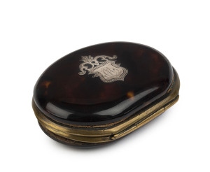 An antique coin purse, tortoiseshell with inlaid silver shield, interior fitted with original blue silk compartments, early 19th century, ​7cm across