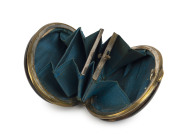 An antique coin purse, tortoiseshell with inlaid silver shield, interior fitted with original blue silk compartments, early 19th century, ​7cm across - 2