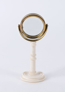 An antique miniature desk top mirror, ivory, brass and glass, early to mid 19th century, 13cm high