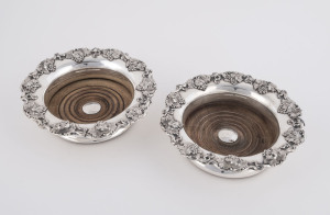 A pair of Georgian Sheffield plate wine bottle coasters, early 19th century, 5cm high, 18cm diameter