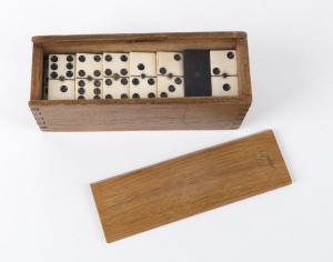 A set of ebony and whalebone dominoes in timber case, 19th century, the case16cm wide