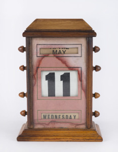 An antique desk calendar, late 19th century, 23cm high