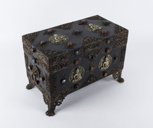 A Sino-Tibetan jewellery trunk, ebonised timber with copper and silver mounts set with semi-precious stones, interior fitted with velvet lined lift out trays, 20th century, ​27cm high, 41cm wide, 23cm deep