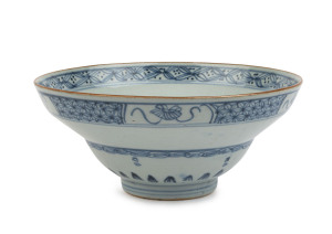 A Chinese porcelain bowl, underglazed in blue with brown rim, early Qing Dynasty, 18th century, 7.5cm high, 18cm diameter