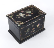 An antique tea caddy, papier-m&acirc;ch&eacute; inlaid with mother of pearl, circa 1840, 11cm high, 16cm wide, 12cm deep