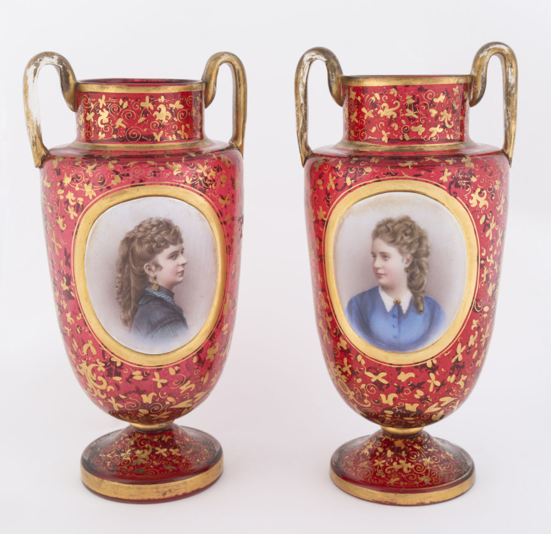 A pair of Bohemian ruby glass vases with hand-painted female portraits, 19th century, ​27cm high