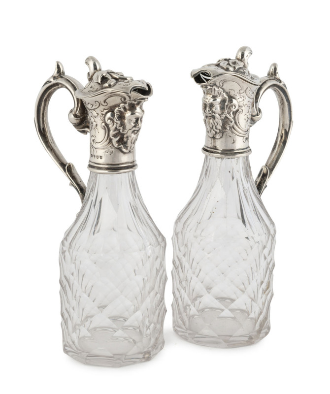 A pair of Georgian sterling silver mounted crystal vinegar and oil jugs, early 19th century ​18cm high