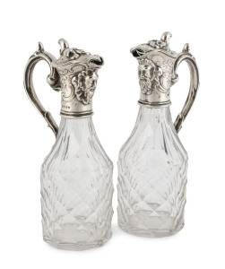 A pair of Georgian sterling silver mounted crystal vinegar and oil jugs, early 19th century 18cm high