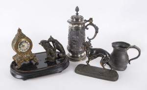 German table clock, antique pewter tankard, German silver plated stein and two cast bronze dog statues, 19th and 20th century, the stein 30cm high