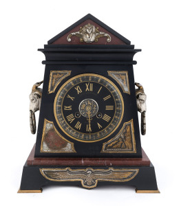 L. MARTI French mantel clock in the Egyptian revival style, Belgium black slate and rouge marble case adorned with gilt bronze and silver finished panels, twin train 15 day time and strike movement stamped "L. Marti Medaille de Bronze". Dial marked "BRUSH