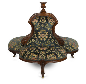 A conversation or chaperone seat, carved walnut frame, circa 1875, 104cm high, 120cm across