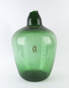 A French wine demijohn, green glass in iron carrier, 20th century, 70cm high, 60cm across the handles