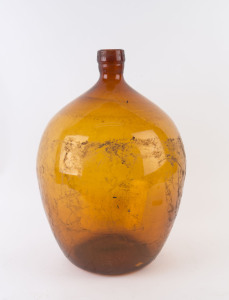 A French wine demijohn, brown glass in iron carrier, 20th century, 52cm high, 44cm diameter