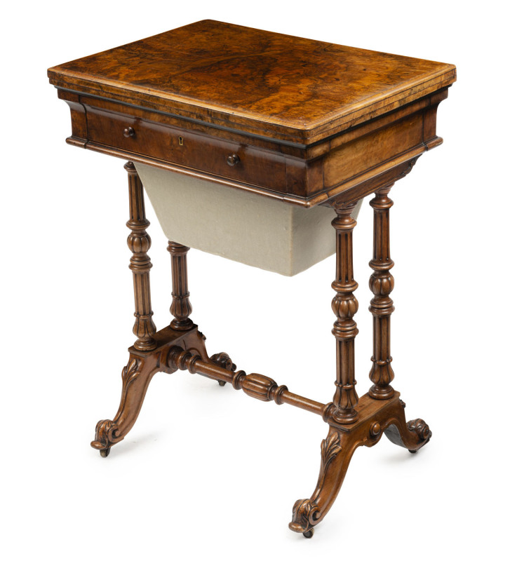 An English sewing table with fold-over games top, burr walnut, drawer fitted with compartments, circa 1860, 75cm high, 56cm wide, 41cm deep