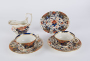 Derby porcelain gravy boat and stand, plus two teacups and saucers, circa 1805, (6 items), the gravy boat 13cm high,
