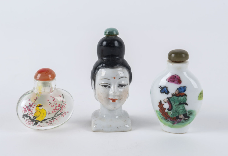 Three Chinese scent bottles, two porcelain examples, 19th century; and one glass with internal hand-painted decoration, 20th century. ​(3 items), the tallest 8.5cm high