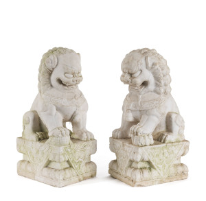 A pair of Chinese carved marble Foo dogs, early to mid 20th century, ​52cm high