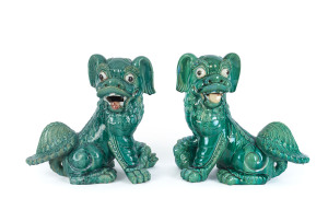 A pair of Chinese ceramic lion statues, mid 20th century, 55cm high