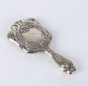 An English Art Nouveau sterling silver hand mirror by Walker & Hall, Sheffield, circa 1903, 25.5cm high