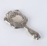 An English Art Nouveau sterling silver hand mirror by Walker & Hall, Sheffield, circa 1903, ​25.5cm high