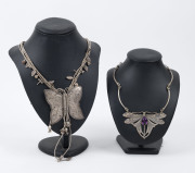 Two silver butterfly necklaces, one set with amethyst, ​pendants 6cm and 8cm high