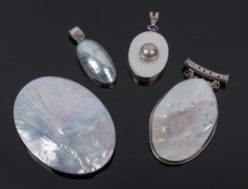 Four vintage pendants, pearl shell and silver, one set with an amethyst, ​the largest 8.5cm high