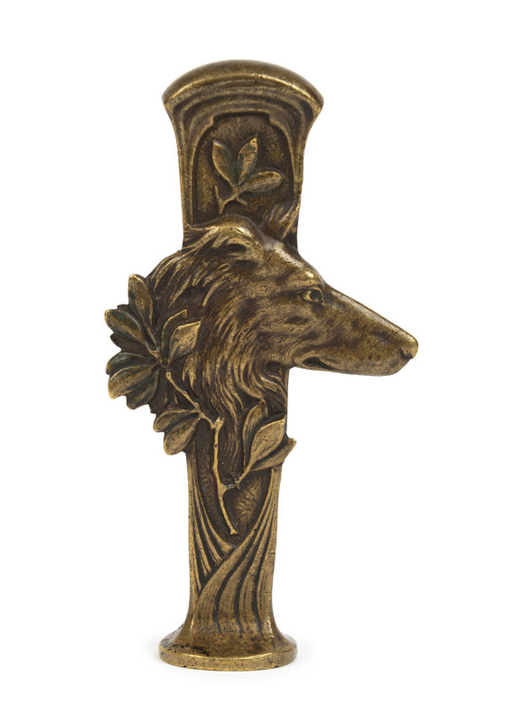 A French Art Nouveau bronze seal in the form of a dog with "E.C." monogram, circa 1895, ​11cm high