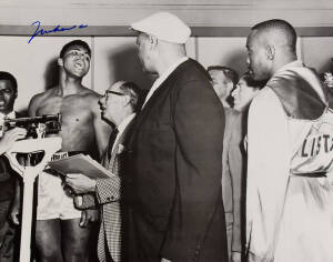 MUHAMMAD ALI, signed b/w photograph of Ali at weigh-in with Sonny Liston, size 51x41cm. With CoA sticker No.0599.