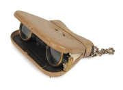 A pair of French folding opera glasses in the form of a purse, mother of pearl and leather with fine gilt tooling, circa 1875, signed "La Mignonne", ​11cm wide