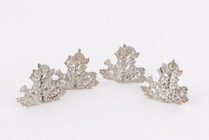 Set of four sterling silver place card holders with thistle, rose and shamrock motif, by Saunders & Shepherd, early 20th century 4cm high, 60 grams total