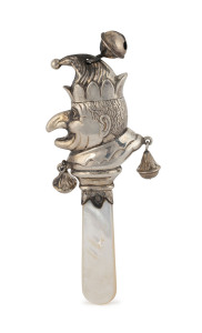 A "Punch" sterling silver baby rattle with mother of pearl handle, by W. H. Collins & Co. Birmingham, circa 1939, 12cm high