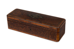 A fine French glove box, kingwood and amboyna inlaid with brass and mother of pearl with ebony stringing, interior sumptuously upholstered in diamond studded blue silk, with original key, circa 1870, 9cm high, 30cm wide, 10cm deep