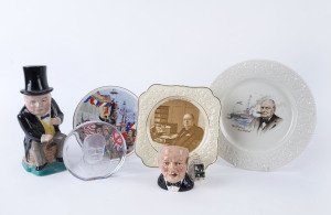 WINSTON CHURCHILL group comprising three porcelain plates, Royal Doulton character jug, Kirklands Embassy Ware toby jug and a crystal plaque by R. Stand, (6 items), the toby jug 26cm high