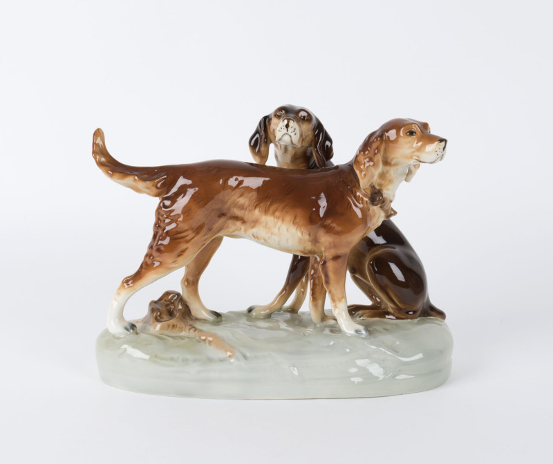ROYAL DUX Austrian porcelain statue of hunting hounds, late 20th century, gold triangle foil label, ​20cm high