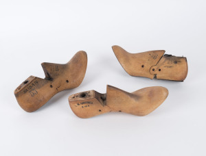 Three shoemaker's lasts, hardwood and iron, early to mid 20th century, the largest size 7½, 24.5cm long