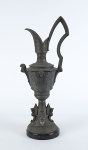 An Egyptian revival spelter ewer on black marble base, late 19th century, 59cm high