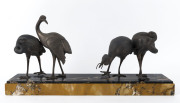 A French Art Deco statue of four cranes, spelter and marble, circa 1930, ​31cm high, 65cm wide