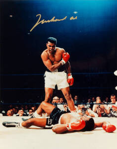 MUHAMMAD ALI, signed colour photograph of Ali standing over Sonny Liston, size 28x35cm. With CoA No.0451.